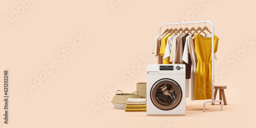 Washing machine and rail with clothes on hangers, empty copy space background