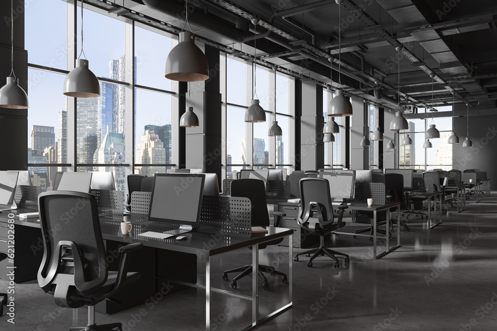 Dark workplace interior with armchairs and table with computers in row, window Dark workplace interior with armchairs and table with computers in row, window
