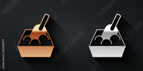 Gold and silver Cat litter tray with shovel icon isolated on black background. Sandbox cat with shovel. Long shadow style. Vector