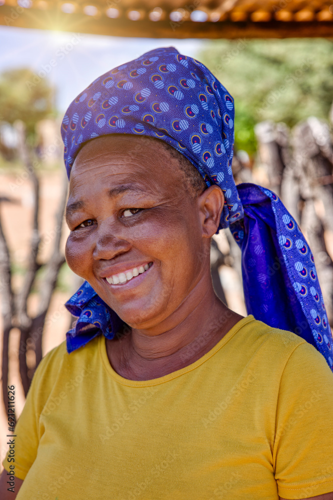 Portrait of a happy African village woman standing in the yard Portrait of a happy African village woman standing in the yard