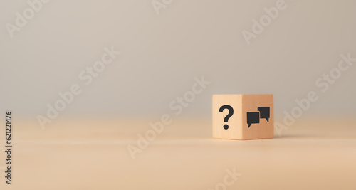 Q and A concept. Q and A symbols on wooden cube block on a grey background. Illustration for frequently asked questions concepts in websites, social networks, business issues. Recommendation concept.