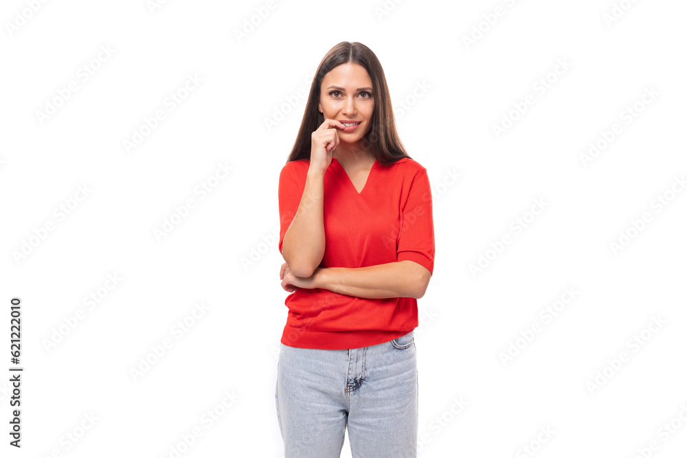 30 year old caucasian woman with straight dark hair is dressed in a red shirt on a white background with copy space 30 year old caucasian woman with straight dark hair is dressed in a red shirt on a white background with copy space