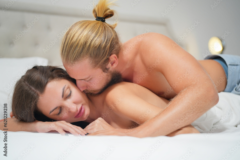 Obraz premium Couple Sexy lover in underwear. Hot couple lover Sensual embracing each other in the bedroom.