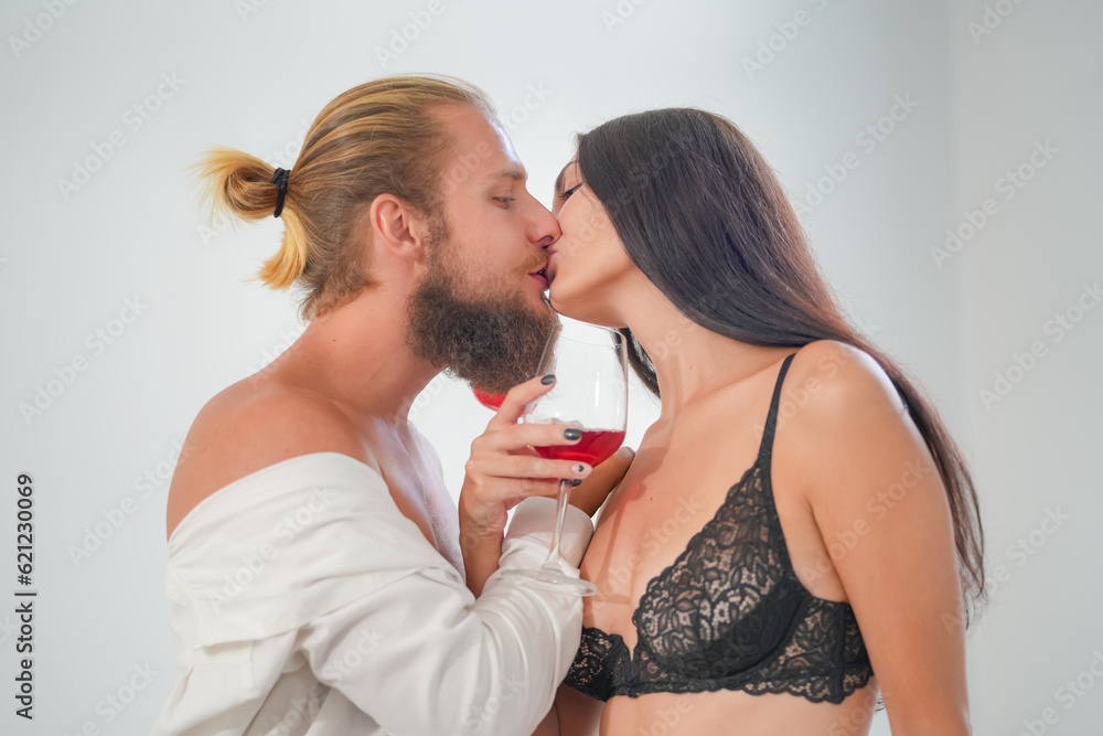 Sexy Young Couple. Young sexy hot couple in love hugging and kissing. Beautiful woman and handsome muscular man close to each other in erotic pose. Sexy Young Couple. Young sexy hot couple in love hugging and kissing. Beautiful woman and handsome muscular man close to each other in erotic pose.