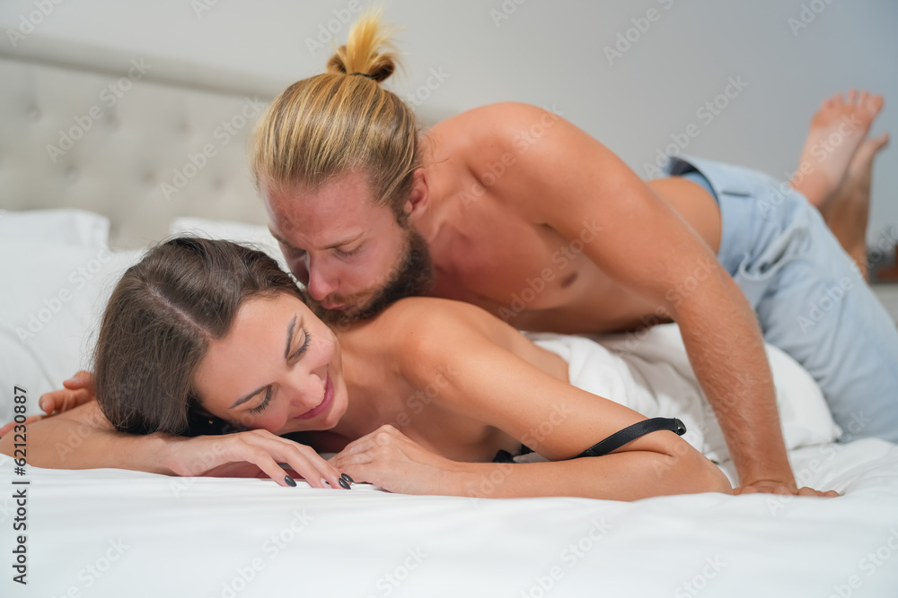 Sexy Young Couple. Young sexy hot couple in love hugging and kissing. Beautiful woman and handsome muscular man close to each other in erotic pose. Sexy Young Couple. Young sexy hot couple in love hugging and kissing. Beautiful woman and handsome muscular man close to each other in erotic pose.