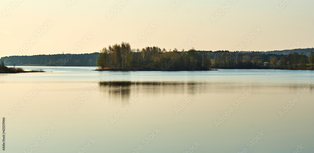 sunrise over the lake with island in middle