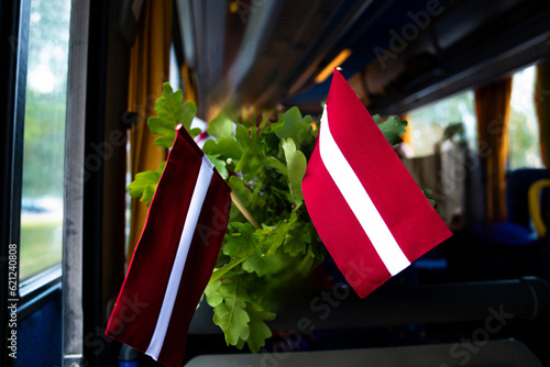 Latvian flag and oak leaves in Latvian Song and Dance Festival photo