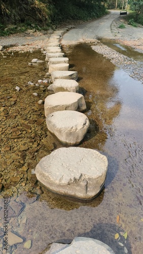 Crossing stones in the river channel of Shuangliu National Recreation Area photo