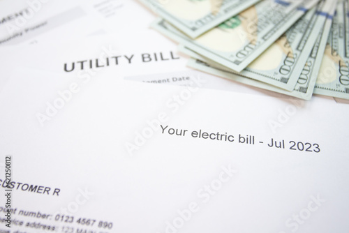 Paper bill with energy and water costs, House utility bill with payment details