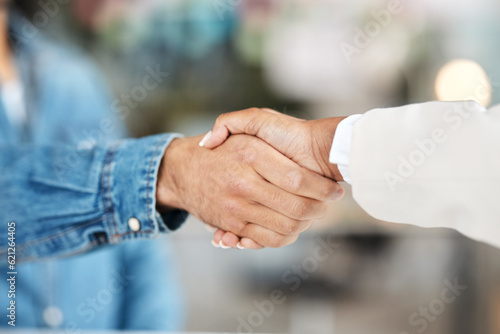 Creative people, handshake and partnership in teamwork for meeting or greeting together at office. Employees shaking hands for introduction or thank you in agreement, deal or welcome team in startup