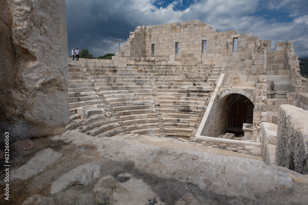 Assembly Hall at archaeological site of ancient city of Patara in Lycia under cloudy sky, Turkey