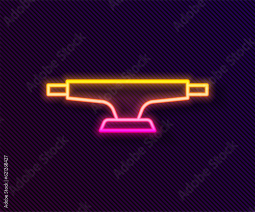 Glowing neon line Skateboard wheel icon isolated on black background. Skateboard suspension. Skate wheel. Vector