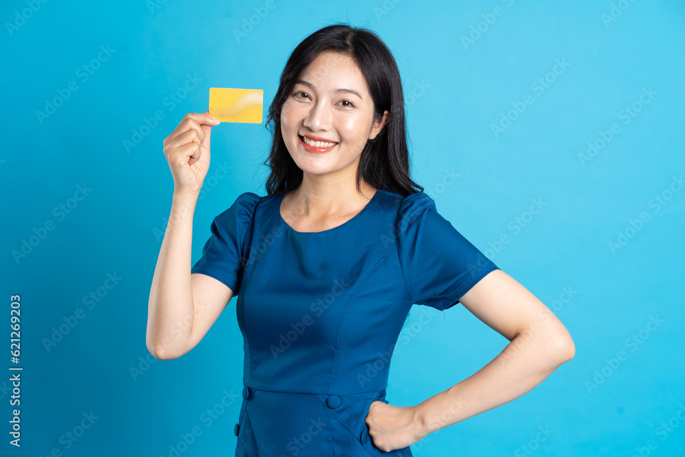 Portrait of beautiful woman in blue dress, isolated on blue background. Portrait of beautiful woman in blue dress, isolated on blue background.