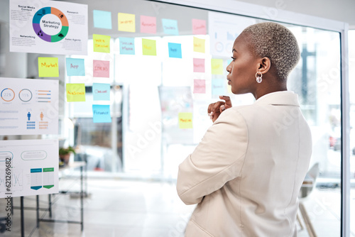 Valokuva Black woman, thinking and glass board for project management, marketing or planning at office