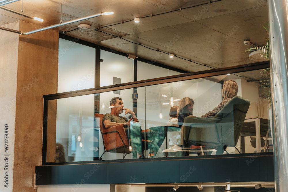 Middle-aged project leaders discussing problems. Worried male project manager listening to his coworker explaining details Middle-aged project leaders discussing problems. Worried male project manager listening to his coworker explaining details