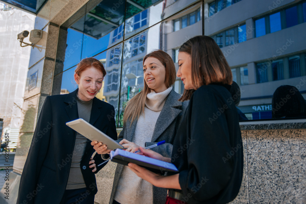 Three girls having fun conversation and smiling while discussing business and working out remotely Three girls having fun conversation and smiling while discussing business and working out remotely