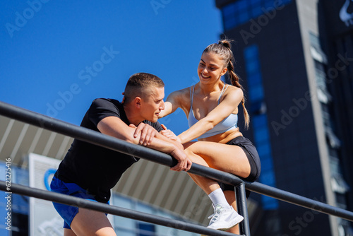 Fotografie Beautiful girl caressing her boyfriend's head and smiling