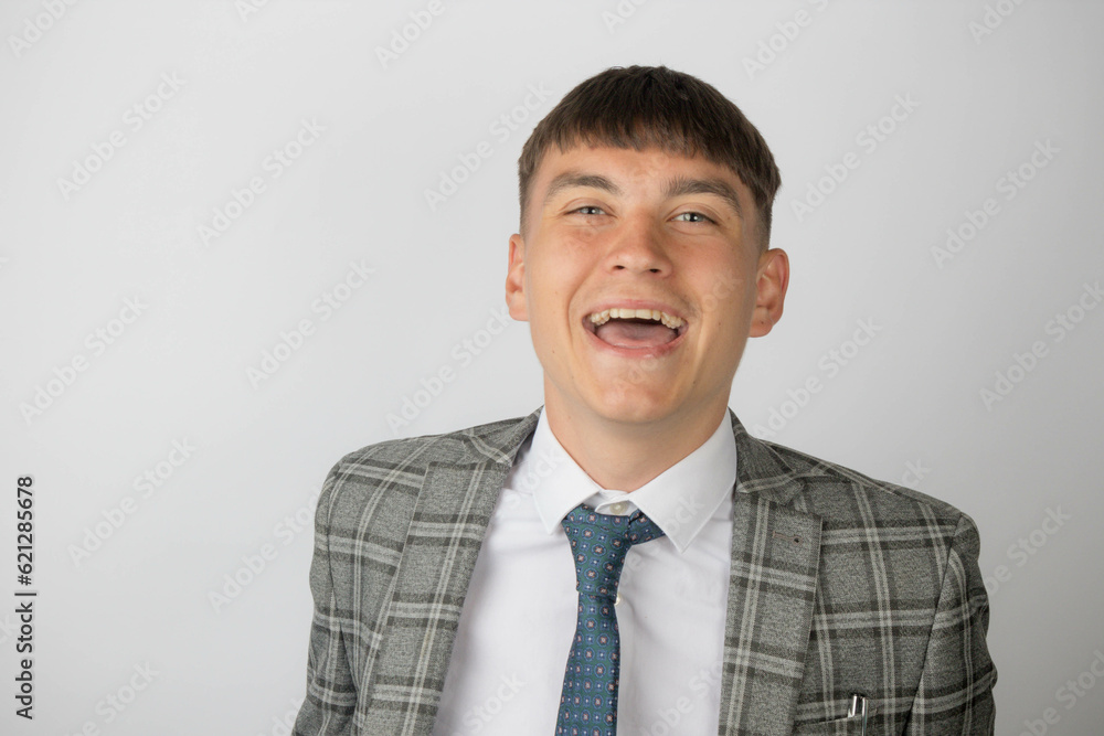Young entrepreneur wearing a suit and tie smiling and laughing Young entrepreneur wearing a suit and tie smiling and laughing