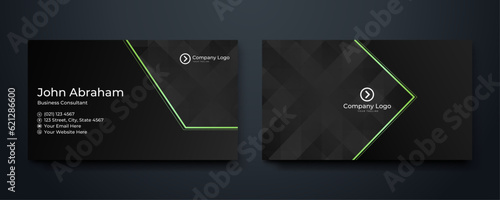 Luxury and elegant black green business cards template on black background.