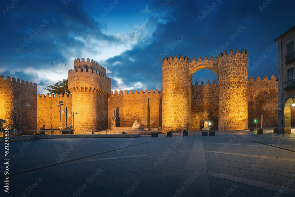 Puerta del Alcazar Gate and Torre del Homenage (Keep) of Medieval Walls of Avila at night - Avila, Spain.