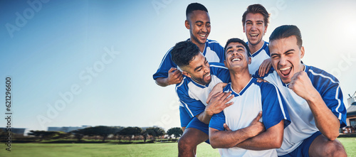 Sports, mockup and a team of soccer players in celebration on a field for success in a game. Football, fitness and motivation with man friends cheering as winners of a competition on a pitch together © Daniels C/peopleimages.com
