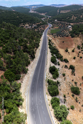 Ajloun, Jordan : An aerial view of the forests, trees, mountains of Ajloun, its streets and roads taken from the Ajloun cable car