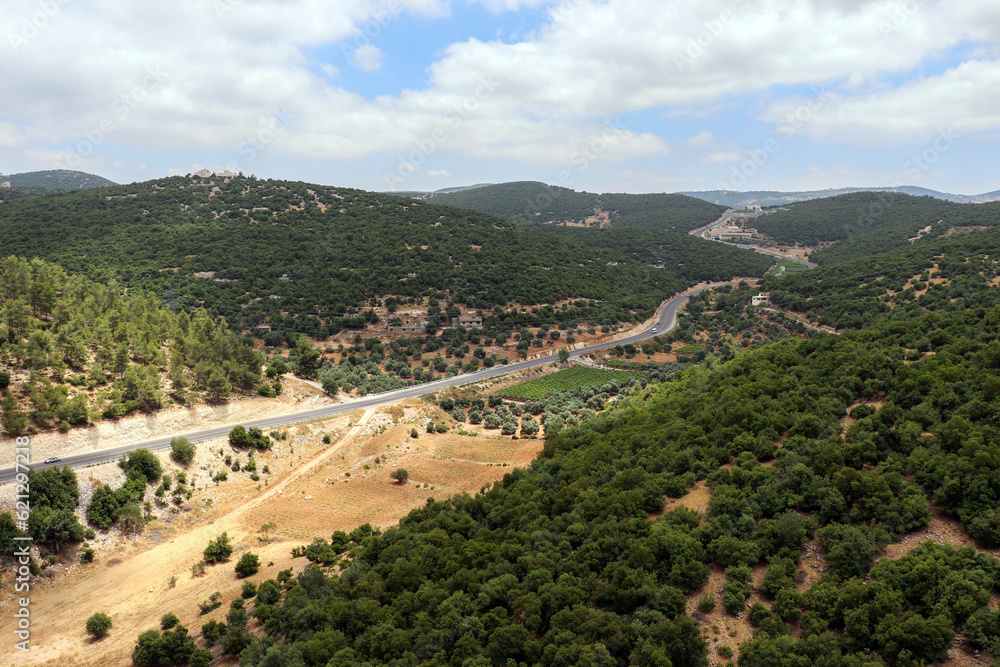 Ajloun, Jordan : An aerial view of the forests, trees, mountains of Ajloun, its streets and roads taken from the Ajloun cable car