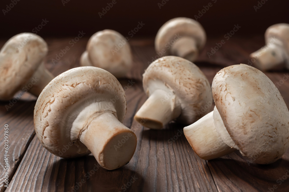 Fresh champignon mushrooms on wooden table, closeup. Fresh champignon mushrooms on wooden table, closeup.