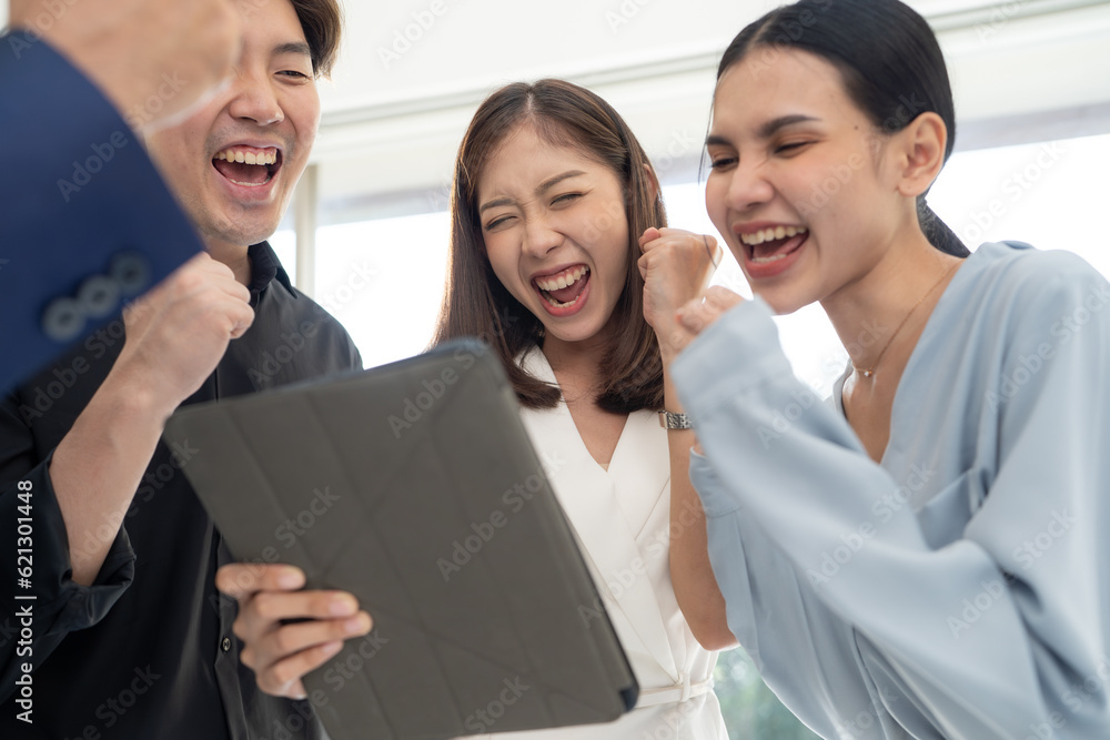 Business people looking in tablet and exciting with they work together. Success busineswoman with colleagues in office. Using digital tablet during a meeting. Business people looking in tablet and exciting with they work together. Success busineswoman with colleagues in office. Using digital tablet during a meeting.