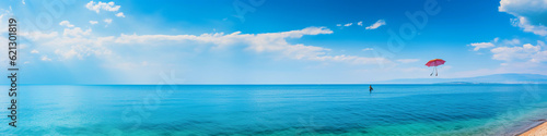 Aerial view of a solitary sailboat on a serene turquoise sea, clear skies, vibrant colors, wide angle © Marco Attano