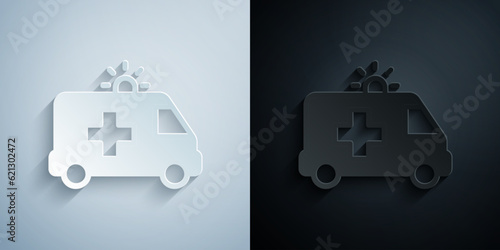 Paper cut Ambulance and emergency car icon isolated on grey and black background. Ambulance vehicle medical evacuation. Paper art style. Vector