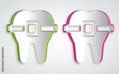 Paper cut Teeth with braces icon isolated on grey background. Alignment of bite of teeth, dental row with with braces. Dental concept. Paper art style. Vector