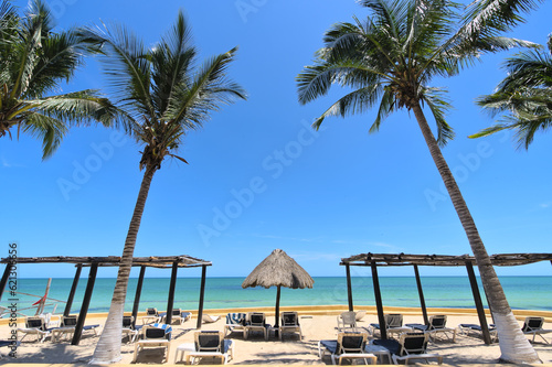 Fototapeta Naklejka Na Ścianę i Meble -  Chairs on a sand beach and horizon (Merida, Yucatan, Mexico)