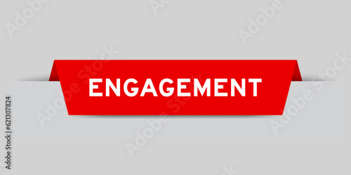 Red color inserted label with word engagement on gray background