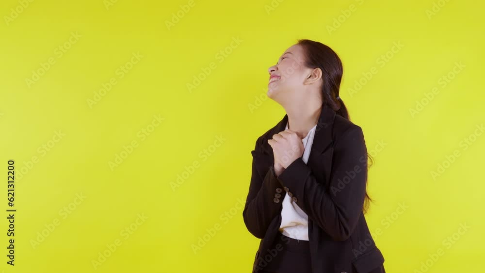 Portrait beautiful businesswoman in suit standing with glad and success isolated on yellow background, young asian business woman is manager or executive smile with confident and excited for victory. Portrait beautiful businesswoman in suit standing with glad and success isolated on yellow background, young asian business woman is manager or executive smile with confident and excited for victory.
