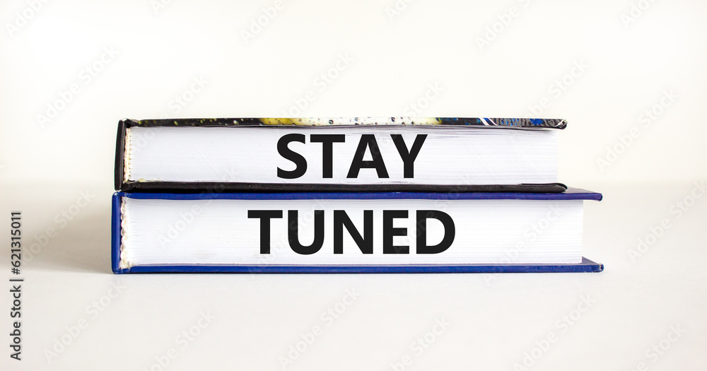 Stay tuned symbol. Concept words Stay tuned on beautiful books on a beautiful white table white background. Business, support, motivation, psychological and stay tuned concept. Copy space.