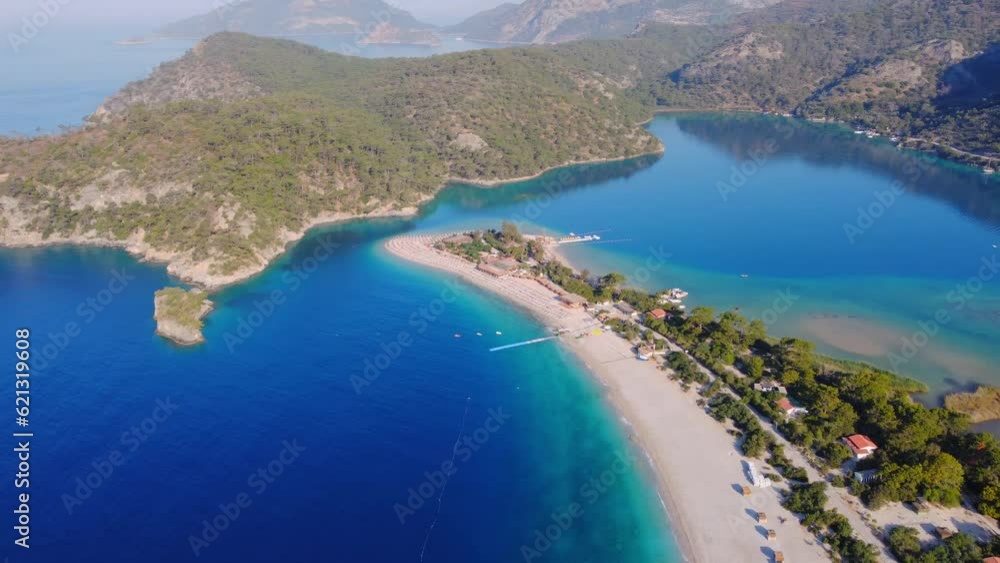 Drone aerial view of sandy seashore with turquoise water in Oludeniz, traveling beach vacations in Turkey Drone aerial view of sandy seashore with turquoise water in Oludeniz, traveling beach vacations in Turkey