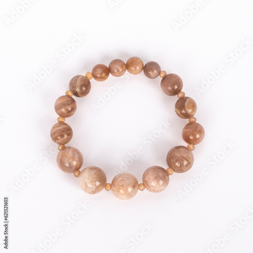 Obraz na płótnie Beige natural stone, Sunstone bracelet. Three different sizes of the stones and small crystals between. w salonie