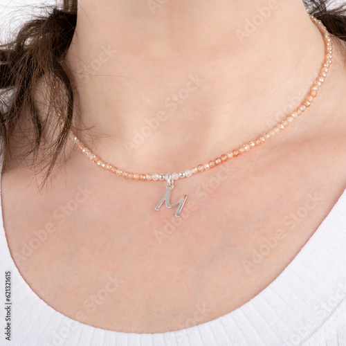 Obraz na płótnie Small beaded Swarovski crystal necklace with silver pendant. Energy crystals, healing stone jewelry. Handmade accessories. Birthstones. w salonie