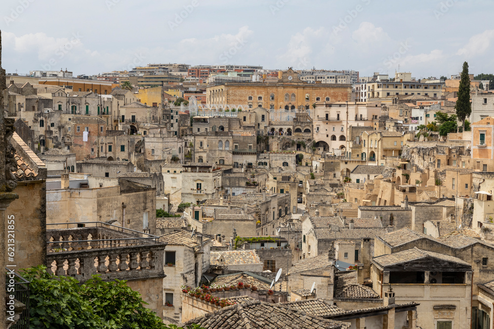 View of the city of Matera by day. Typical Salento illuminations during the holidays. Feast of the Brown Madonna, Matera. Prehistoric caves from the Murgia.Mysterious and ancient land among the stones