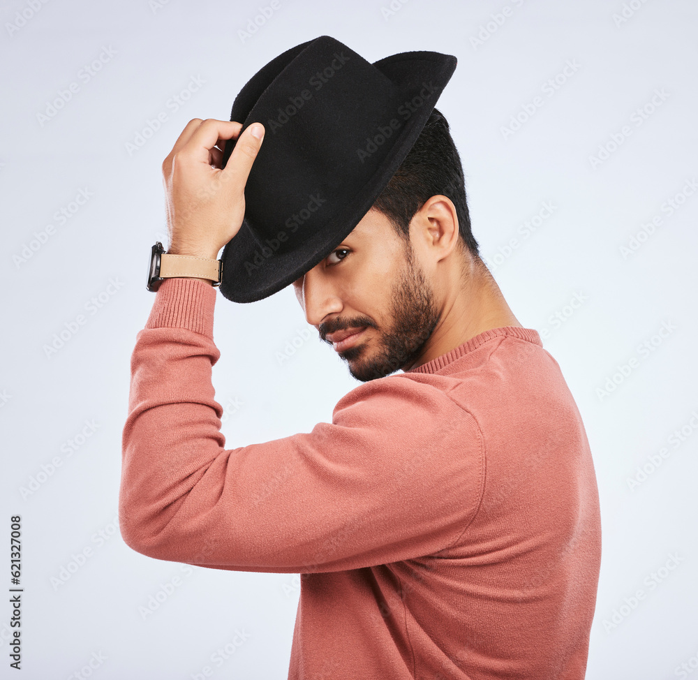 Retro, fashion and portrait of man with a hat for vintage style or hipster clothing trend in white background. Studio, Indian model and serious face with cool, confidence or person acting as a spy Retro, fashion and portrait of man with a hat for vintage style or hipster clothing trend in white background. Studio, Indian model and serious face with cool, confidence or person acting as a spy