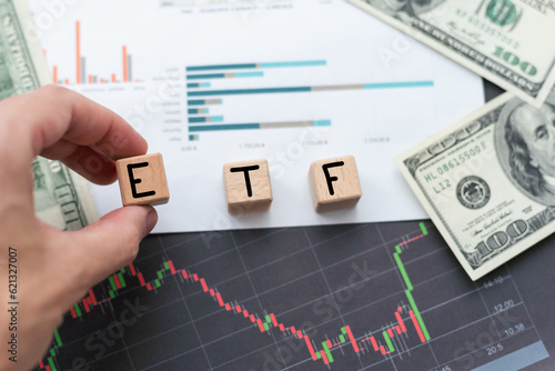 inscription ETF next to us money. ETF is exchange-traded fund. Passive investing