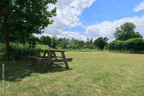 A picnic table under a tree in the Kent countryside