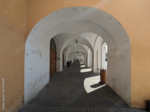 Bilina historical city center with fountains and cobble stone square  churches and castle above the old town