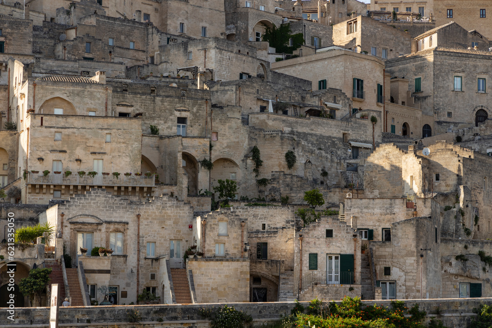 View of the city of Matera by day. Typical Salento illuminations during the holidays. Feast of the Brown Madonna, Matera. Prehistoric caves from the Murgia.Mysterious and ancient land among the stones