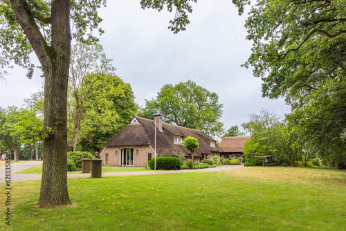 Traditional farmhouse with thatched roof in Odoorn in Drenthe The Netherlands