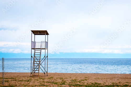 an empty rescue tower by the water