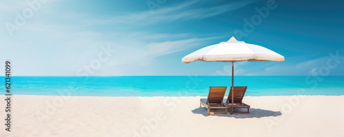 Beach chairs with umbrella and beautiful sand beach, tropical beach with white sand and turquoise water. Travel summer holiday background concept. copy space