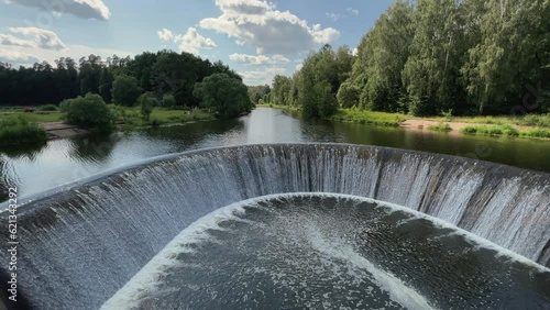 View of the Yaropoletskaya HPP dam named after V.I. Lenin on a warm summer day photo