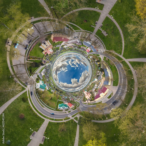 blue sphere inside overlooking old town, urban development, historic buildings and crossroads. Transformation of spherical 360 panorama in abstract aerial view.